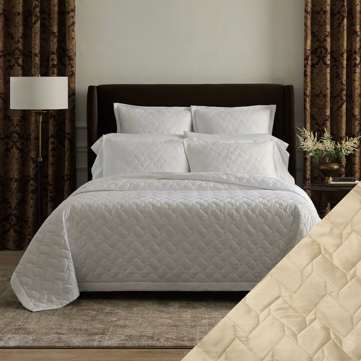 A neatly made bed with White Sferra Palatino Quilt and Shams, and a Sand quilt close-up in the corner.