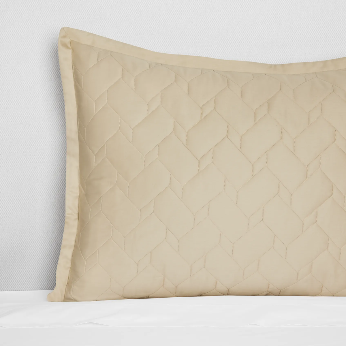 A Sand Close-up of Sferra Palatino Sham, featuring a crisp geometric pattern