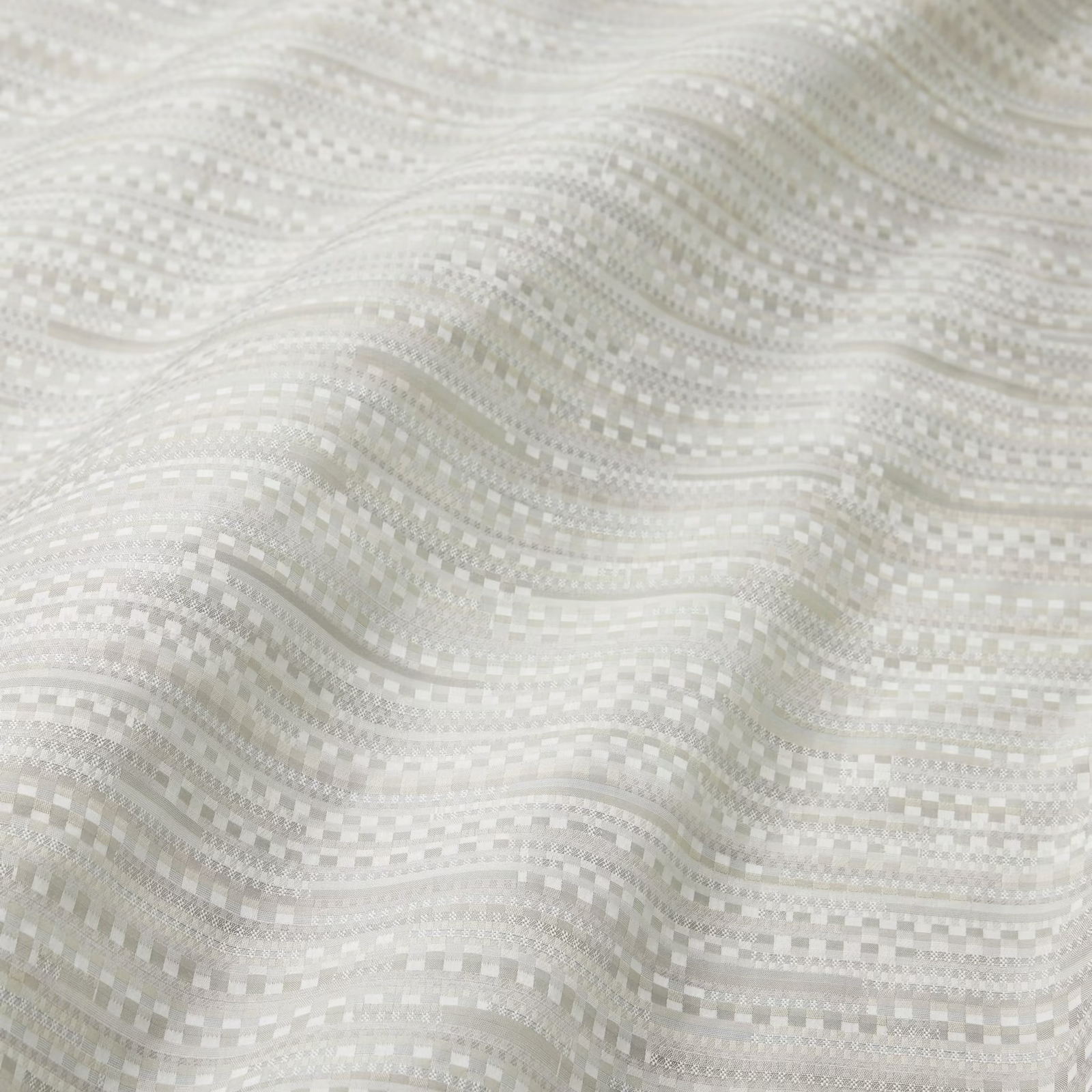 Bed in Bone color Sferra Pellestrina Duvet Cover and Shams