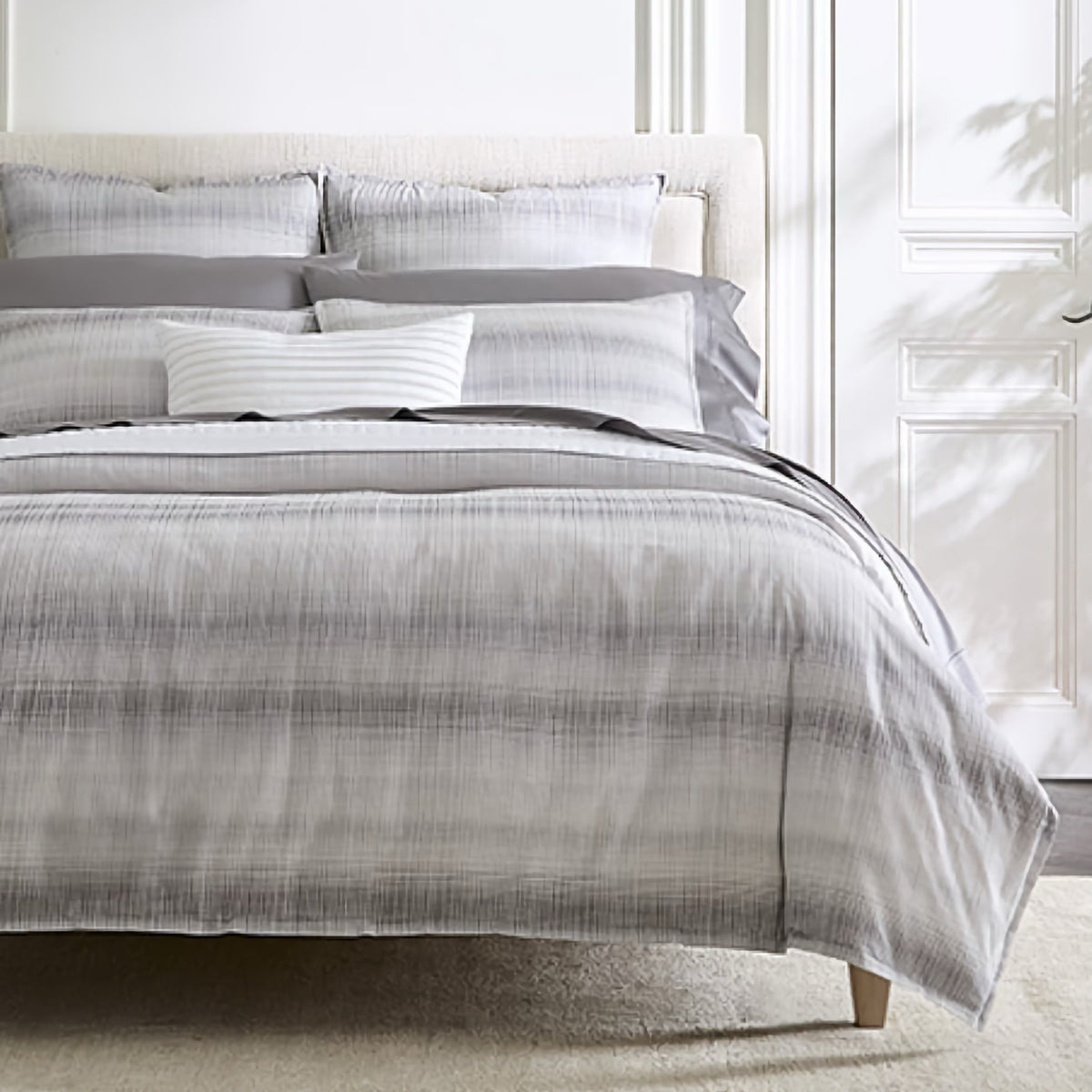 Corner view of Sferra Perugia Duvet Cover and Shams in Lunar color