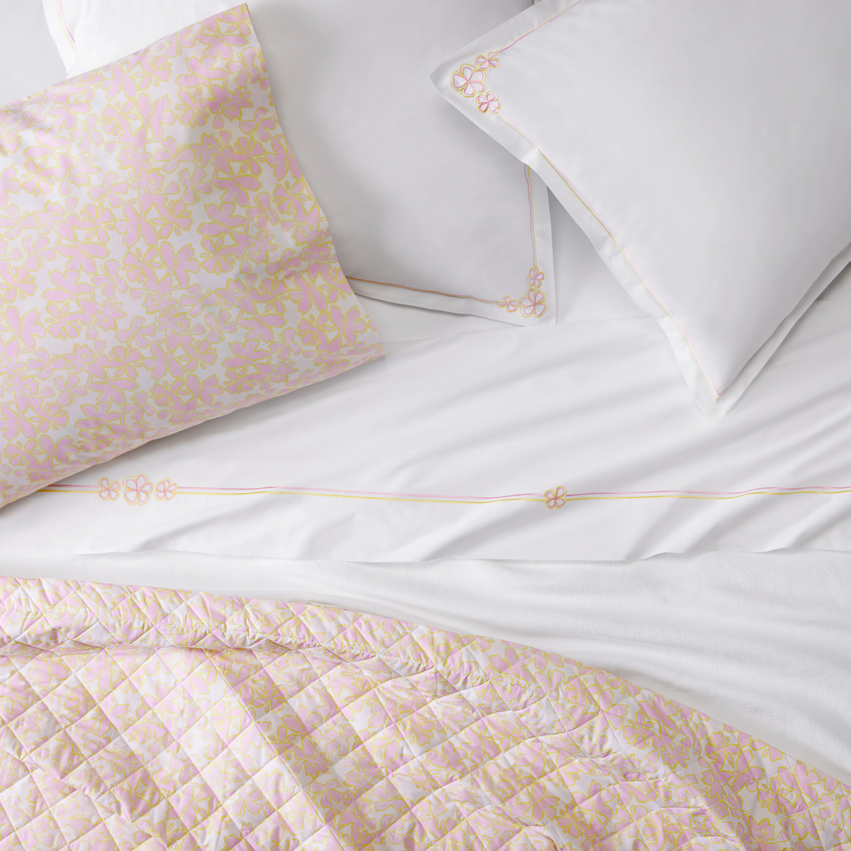 Sferra Prato Bedding Lifestyle with Fiorino Shams and Sheets Carnation
