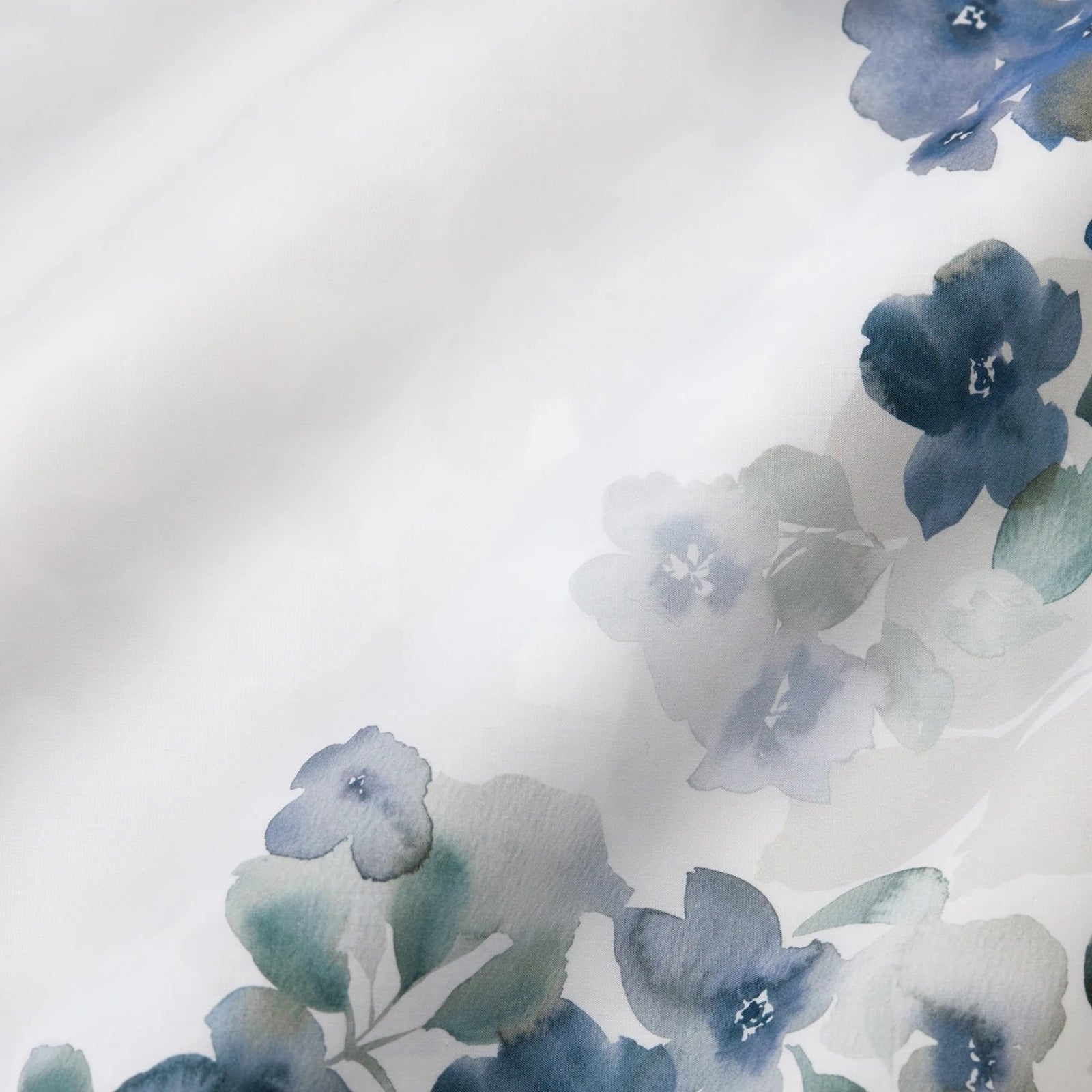 Bed Dressed in Sferra Primavera Bedding in Sea Color