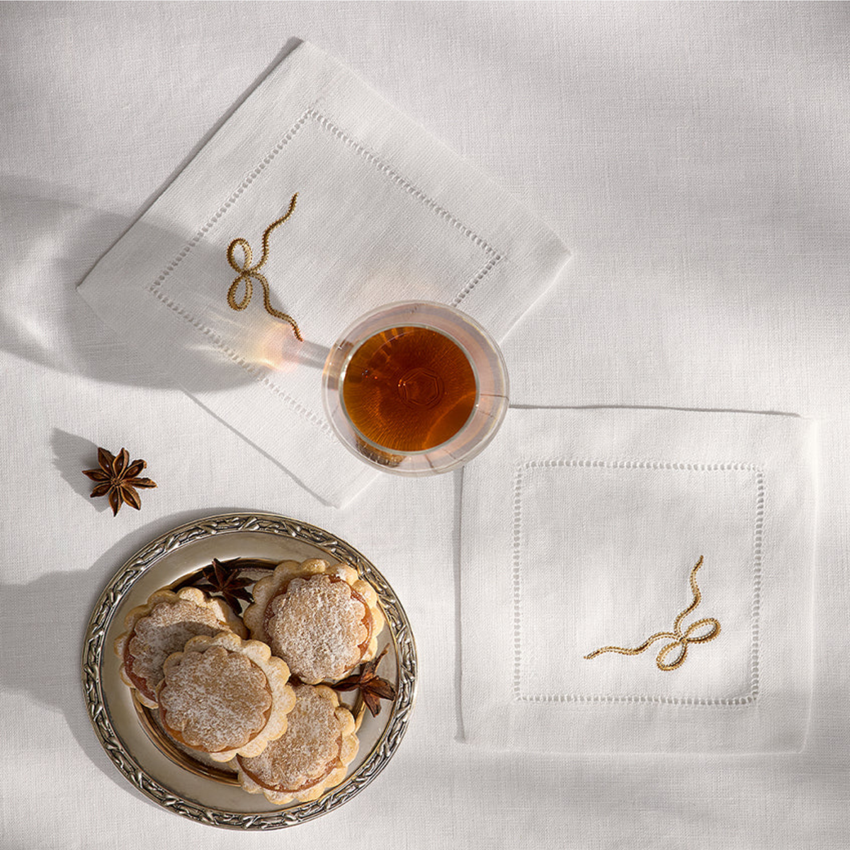 Top View of Sferra Regalo Cocktail Napkins with White and Beige colors