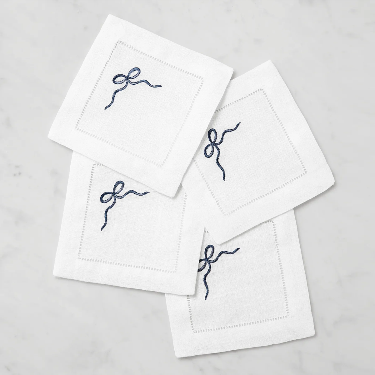 Stack of Sferra Regalo Cocktail Napkins with White and Blue colors