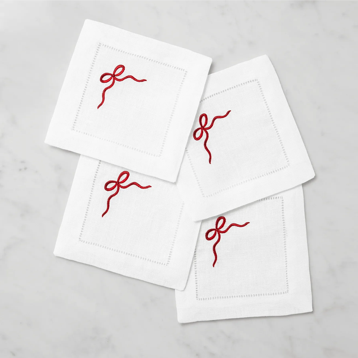 Stack of Sferra Regalo Cocktail Napkins with White and Red colors