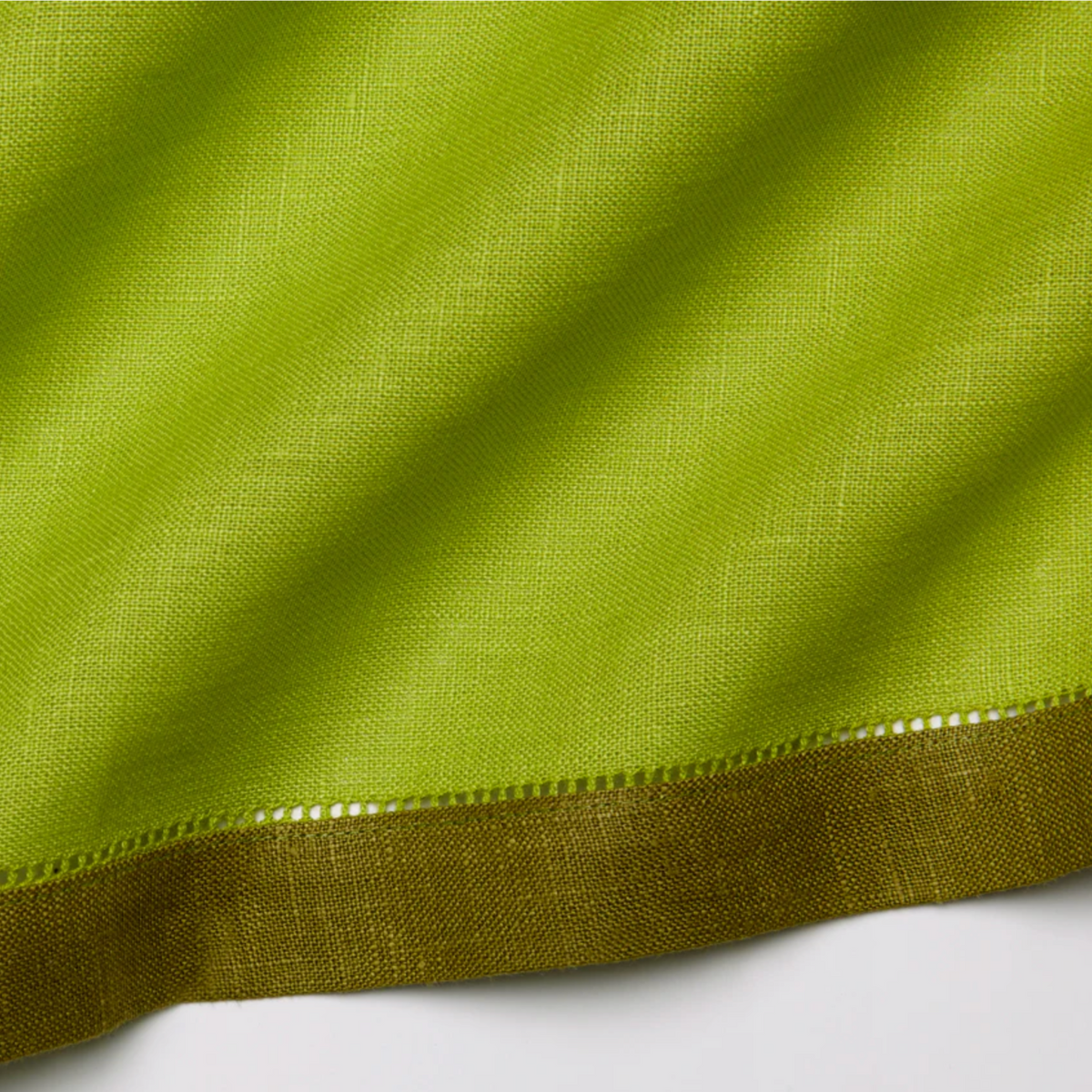 Closeup of Sferra Roma Napkin Fabric in Apple and Avocado Color