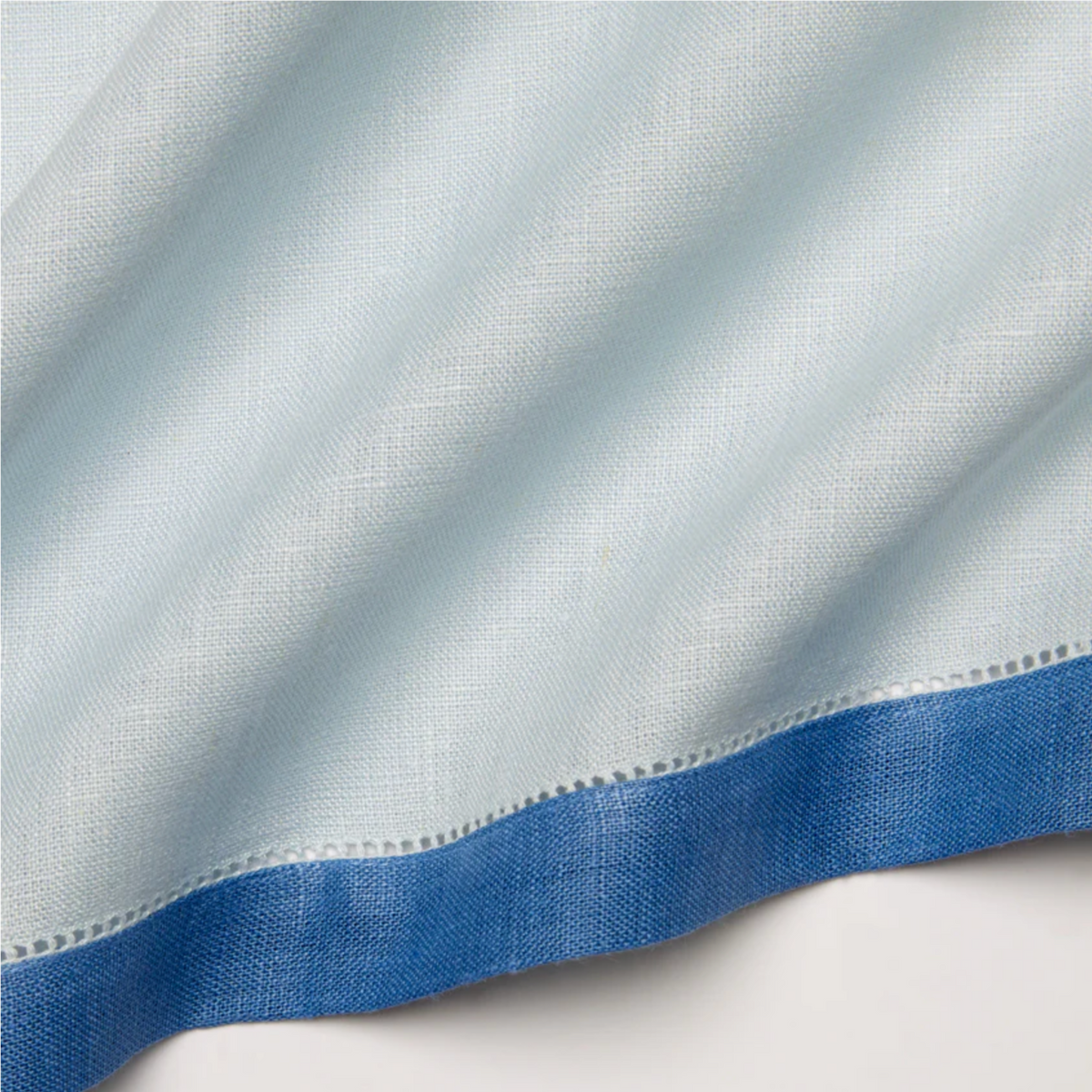 Closeup of Sferra Roma Napkin Fabric in Sky and Ocean Color