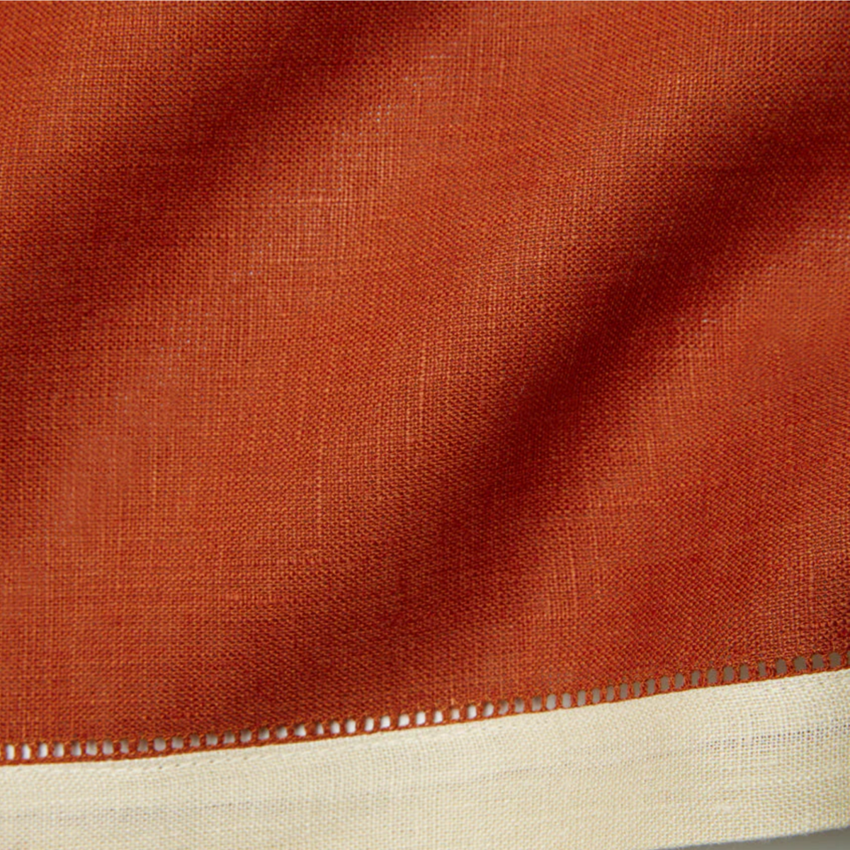 Closeup of Sferra Roma Napkin Fabric in Stone and Paprika Color