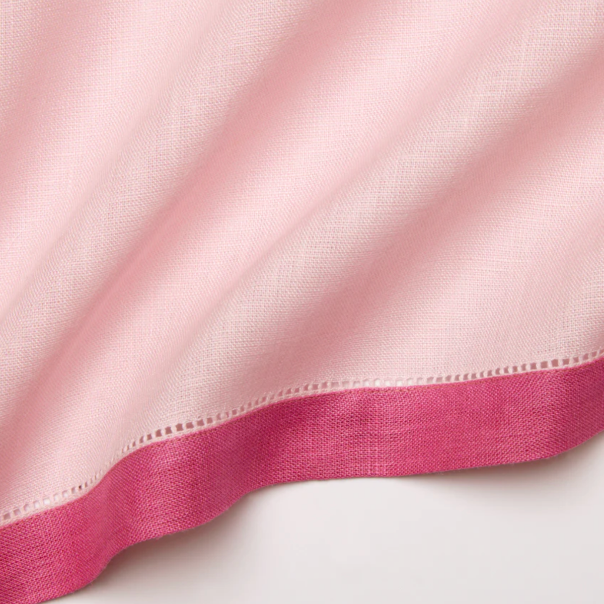 Closeup of Sferra Roma Napkin Fabric in Carnation and Pink Color