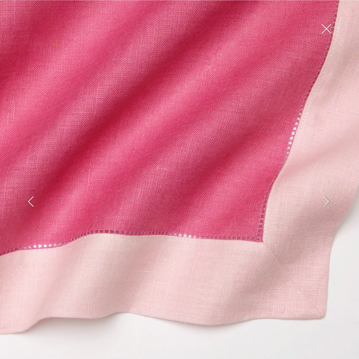 Closeup of Sferra Roma Placemat Fabric in Pink and Carnation Color