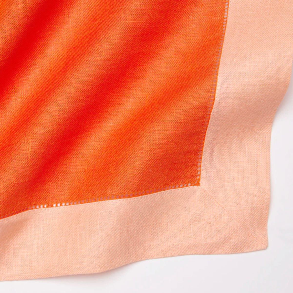 Closeup of Sferra Roma Placemat Fabric in Tangerine and Cameo Color
