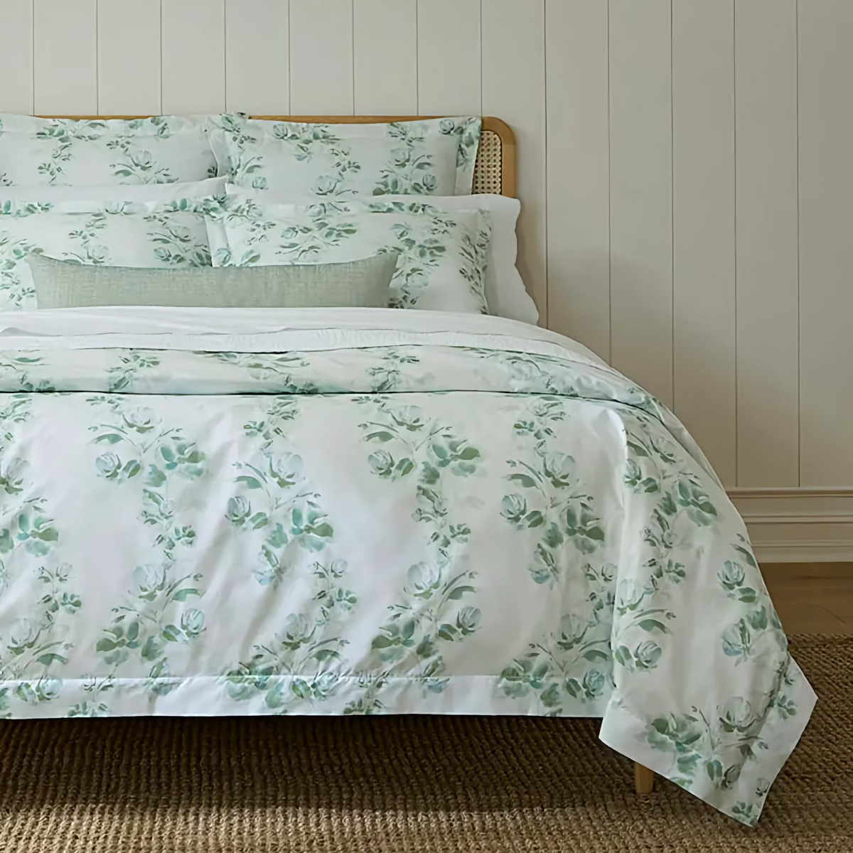 Closeup of Bed in Poolside color Sferra Rosa Duvet Cover and Shams