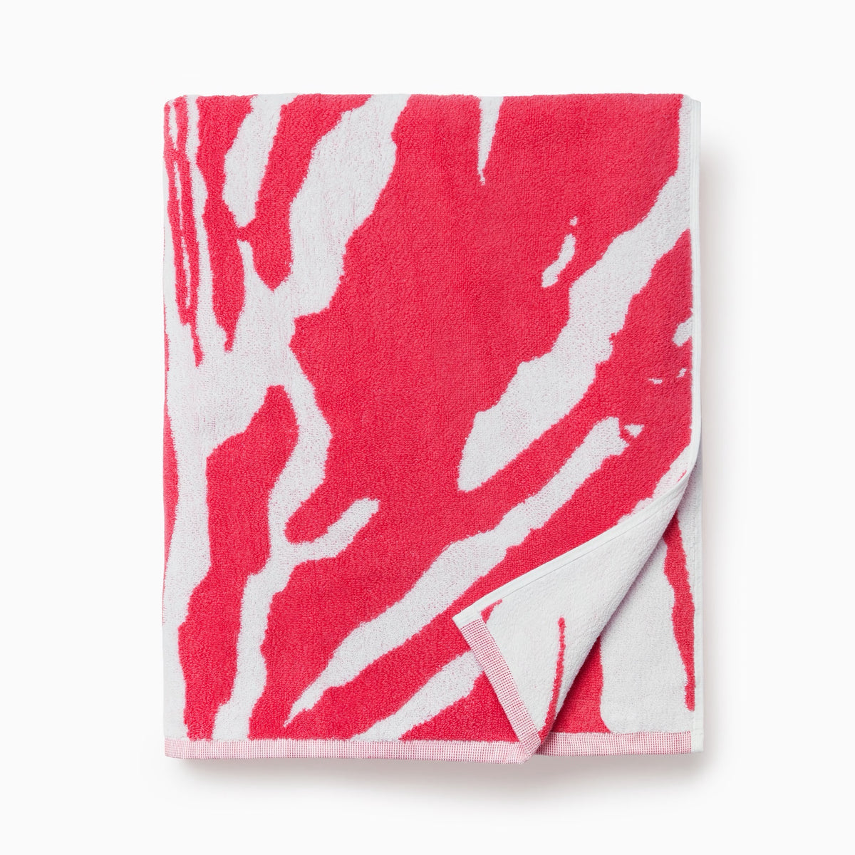 Folded Sferra Sampieri Beach Towels in Coral color