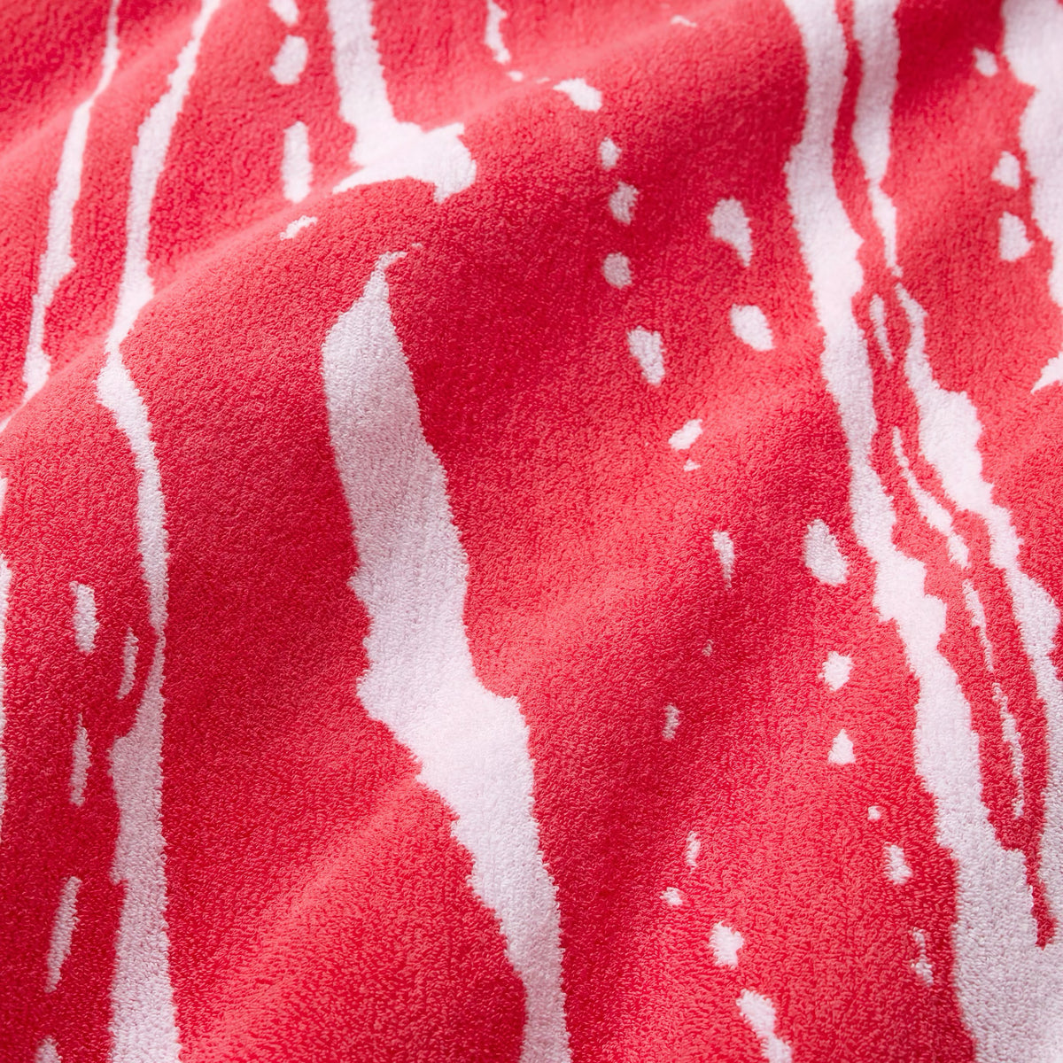 Fabric Closeup of Sferra Sampieri Beach Towels in Coral color