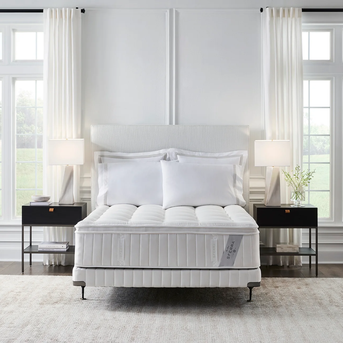 A Sferra Sonno Notte CV Pillowtop Mattress, flanked by two black nightstands and lamps.