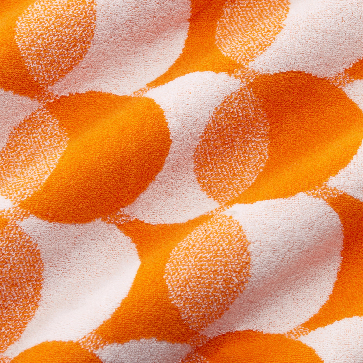 Fabric Closeup of Sferra Sorrento Beach Towels in Mango Color