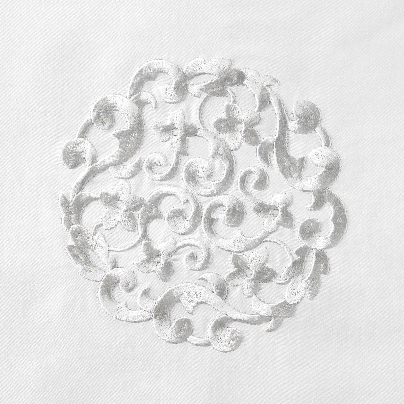 Sferra Storia Decorative Pillow At the Center of a Bed