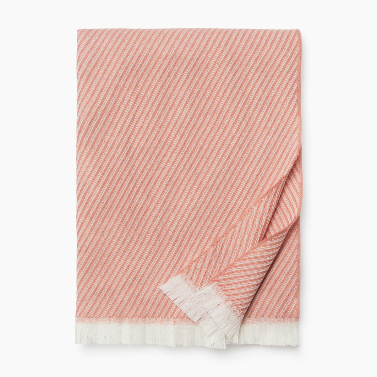 Folded Sferra Taormina Throw in Rose color against a white background