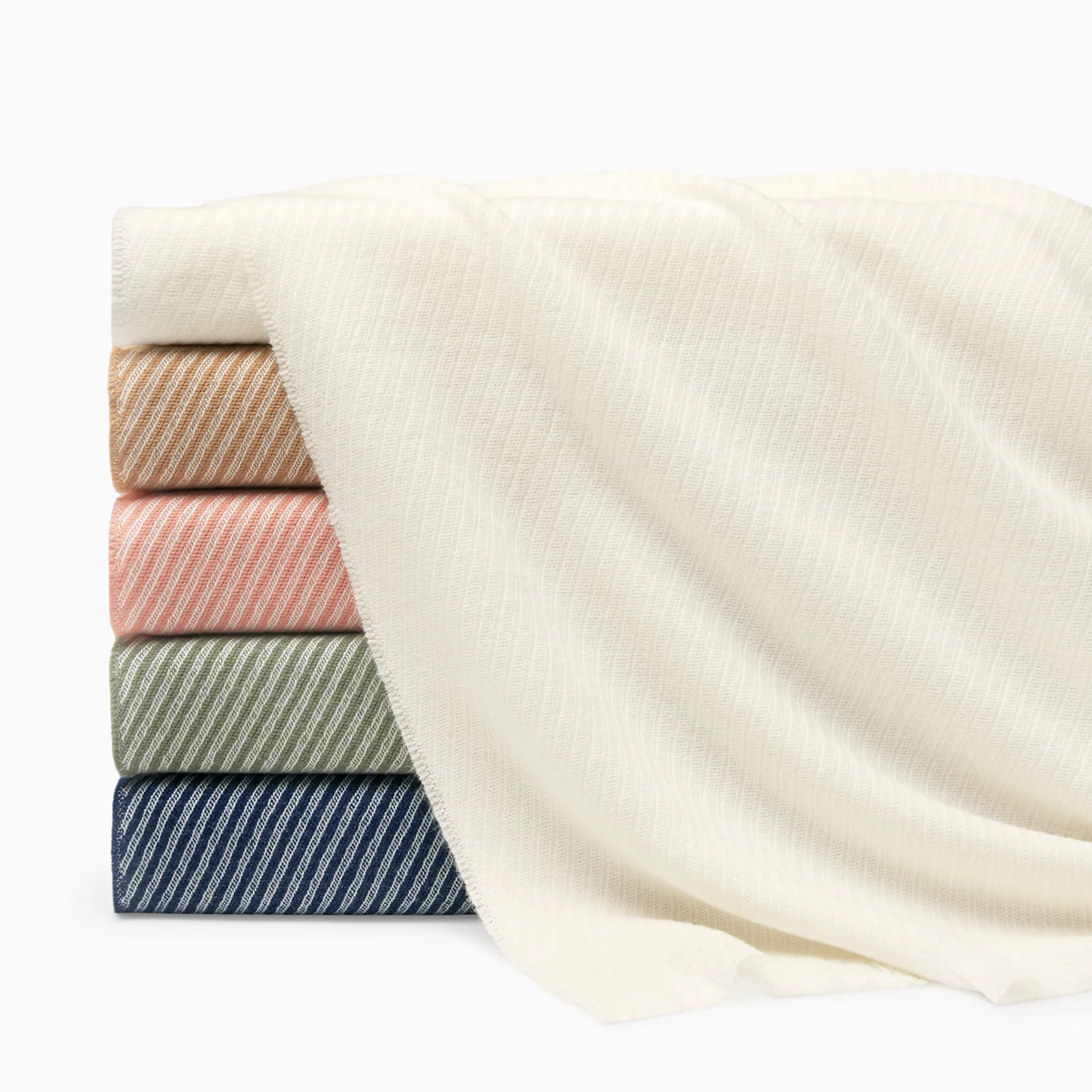 Stack of Sferra Taormina Throws in five 2026 colors