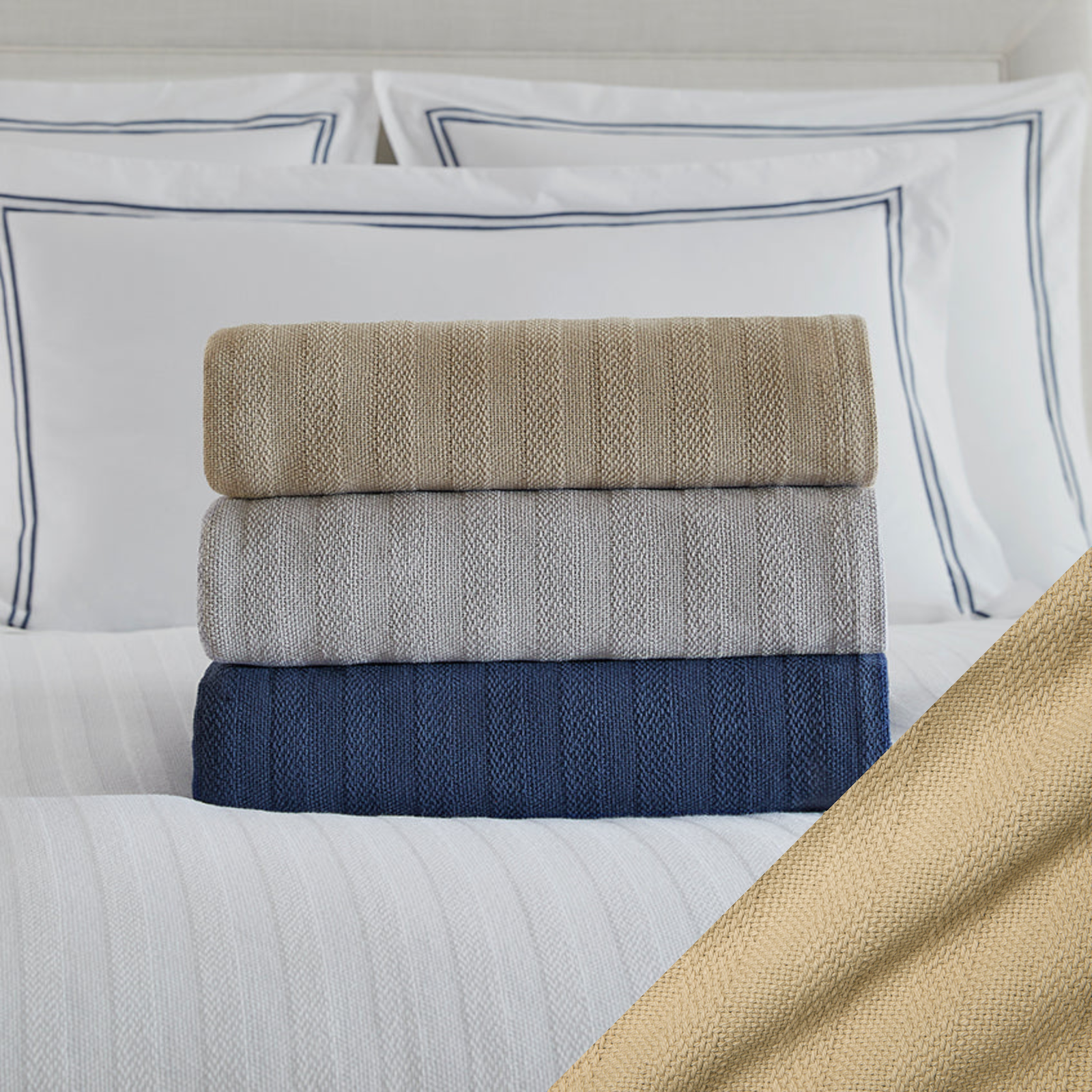 Stack of Folded Sferra Tavira Blanket on a Bed with Dark Khaki Swatch