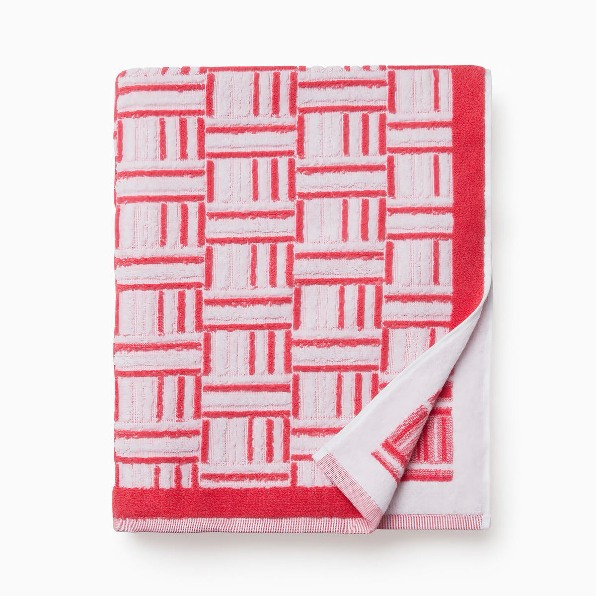 Folded Sferra Tirreno Beach Towels in Coral color