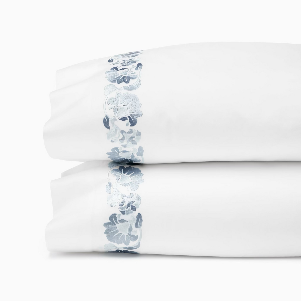 Pillowcases of White and Sea Sferra Tralcio Bedding