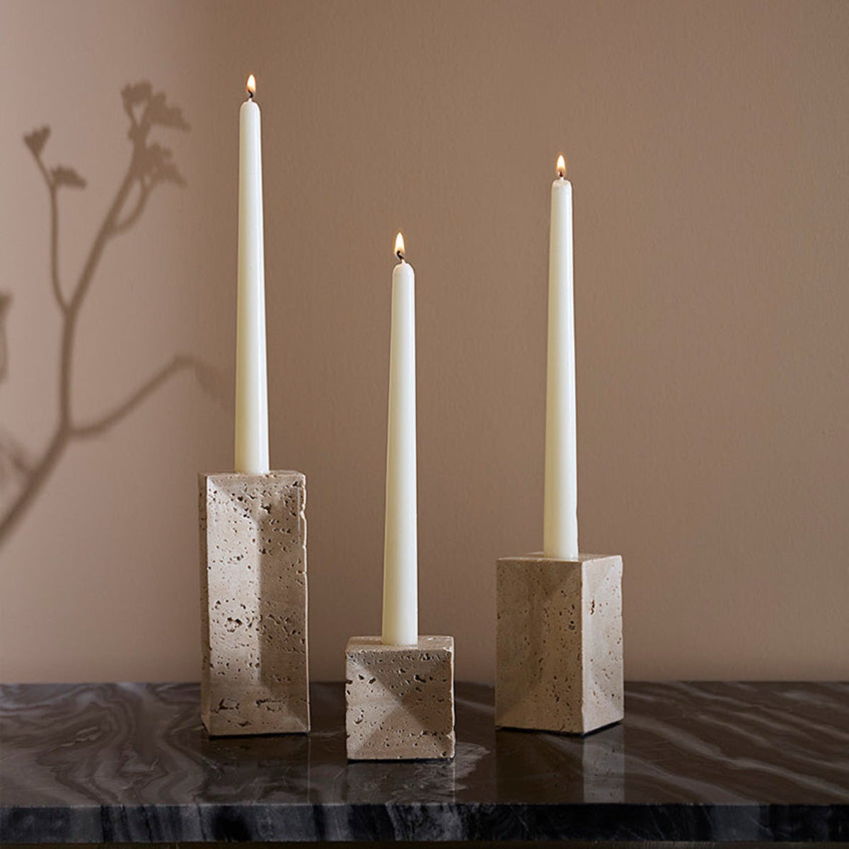 Sferra Travertino Stone Candle Holder in Beige with lighted candles