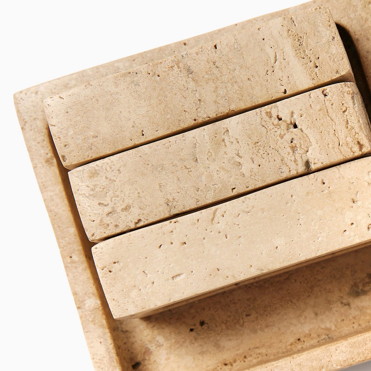 Closeup of Sferra Travertino Stone Napkin Rings in Beige