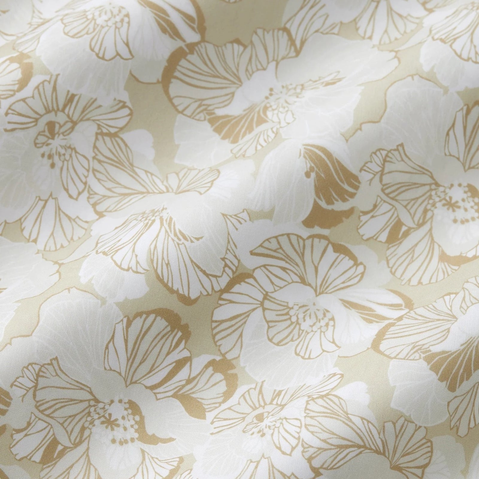 Bed Dressed in Sferra Tropici Bedding in Sand Color