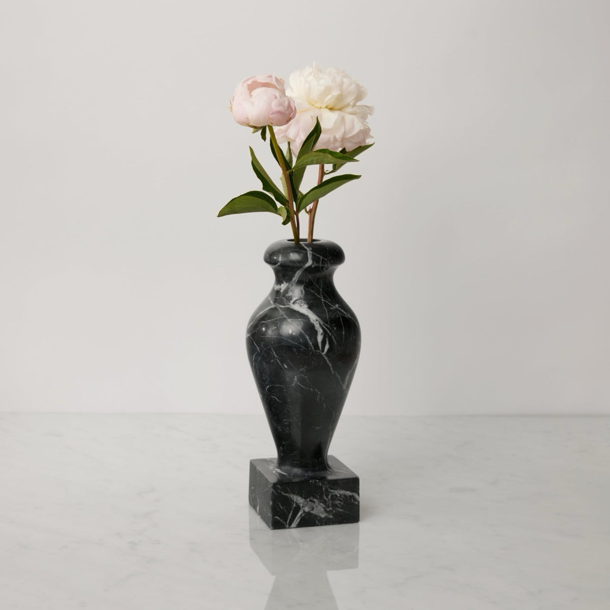 Sferra Vara Marble Pedestal Vase in Black with flowers