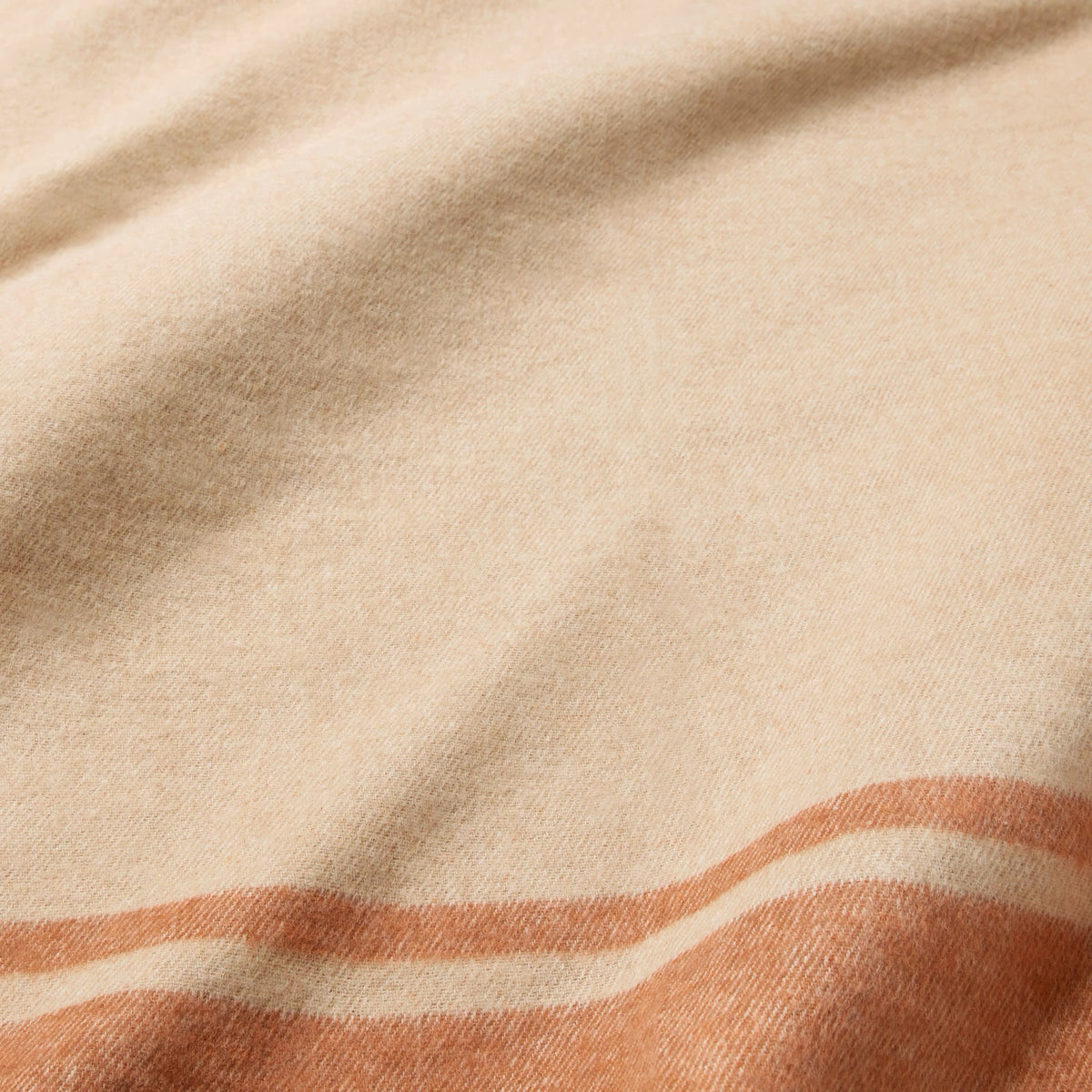 Fabric of Sferra Viletta Throw Blanket in Sand/Rust