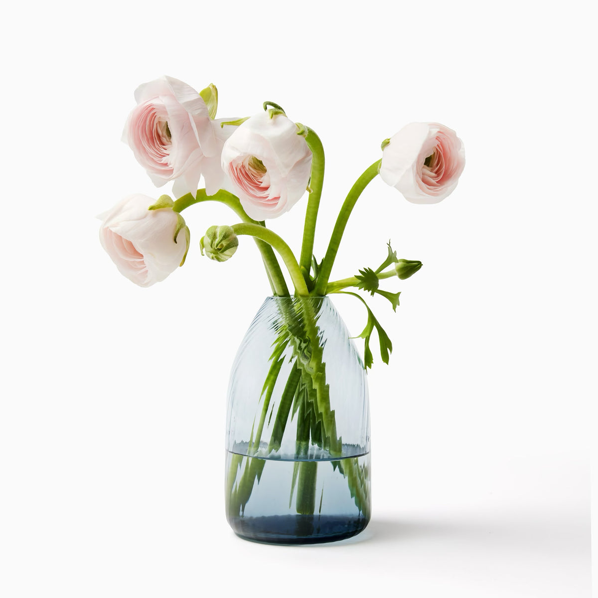 Sferra Vortice Vase in Ocean color with flowers