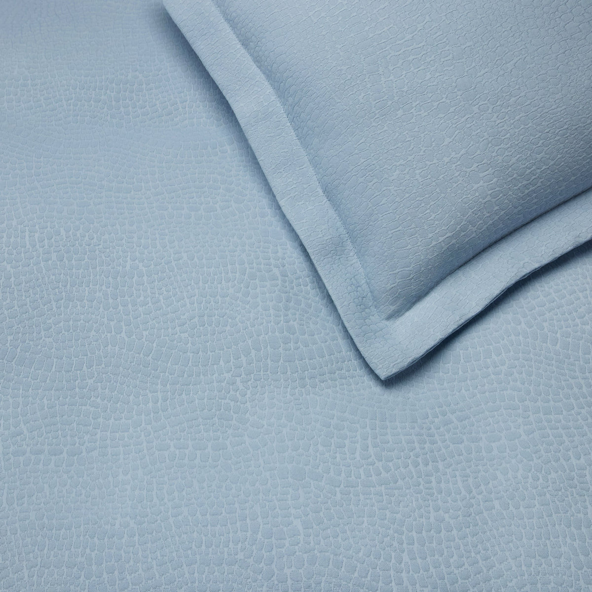 Detail view of Sferra X Scalamandre Cobblestones Coverlet and Shams in Sea
