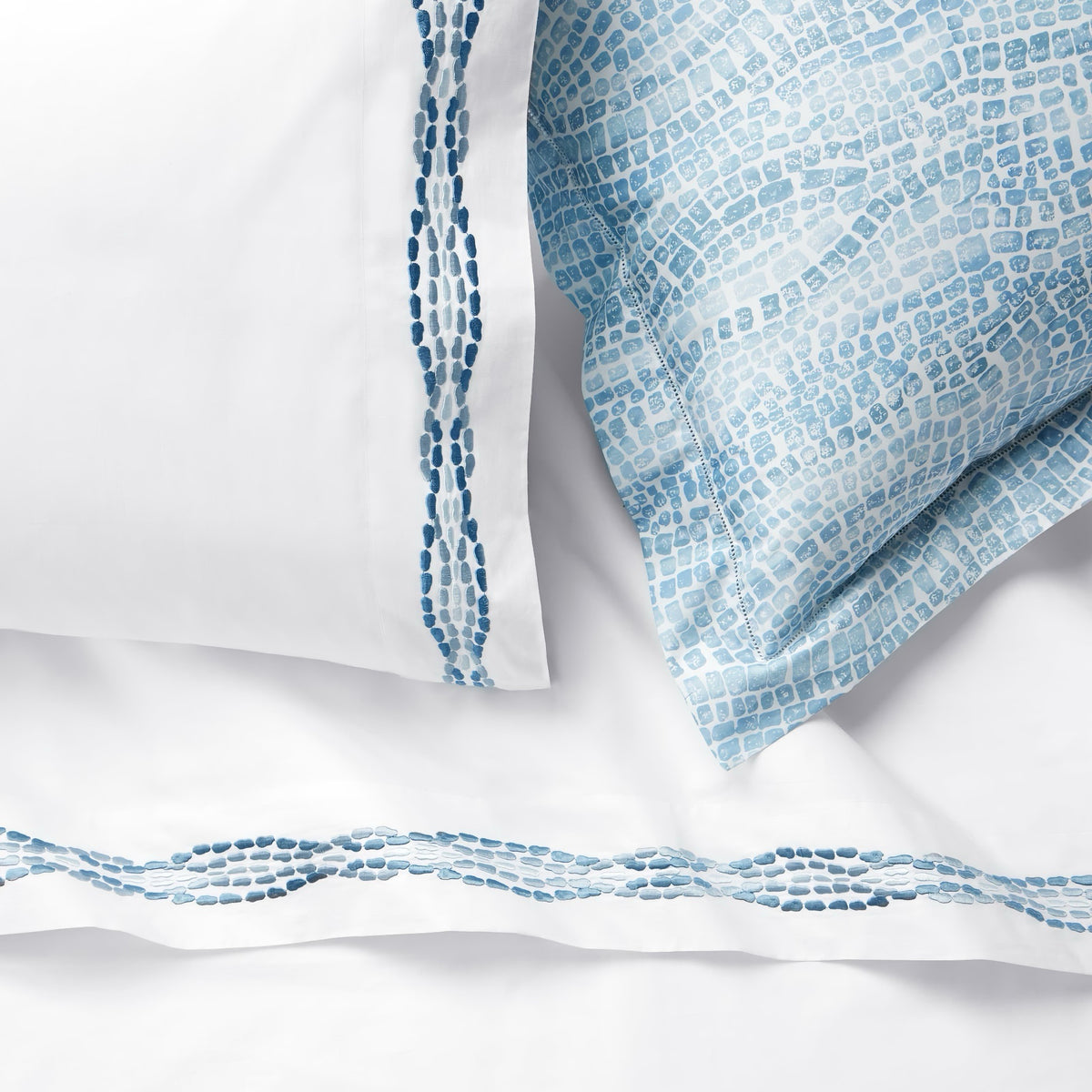 Detailed view of Sferra X Scalamandre Cobblestones Embroidered Bedding in White/Sea color with Printed
