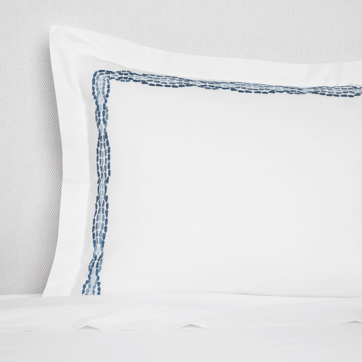 Sham Closeup of Sferra X Scalamandre Cobblestones Embroidered Bedding in White/Sea color