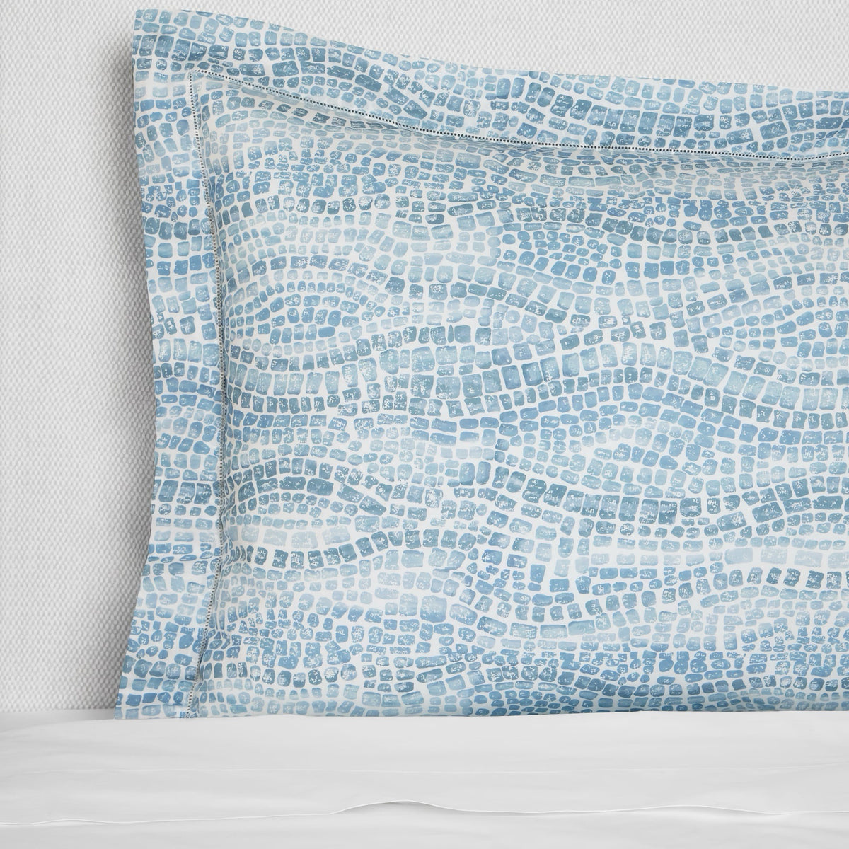 Closeup of Sferra X Scalamandre Cobblestones Printed Sham in Sea color