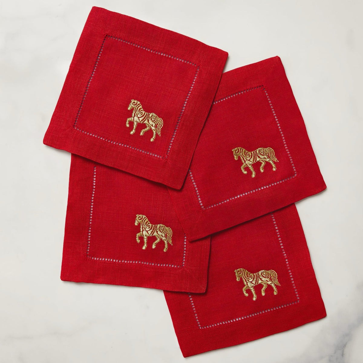 Stack of Sferra Year of the Horse Cocktail Napkins in Red and Gold