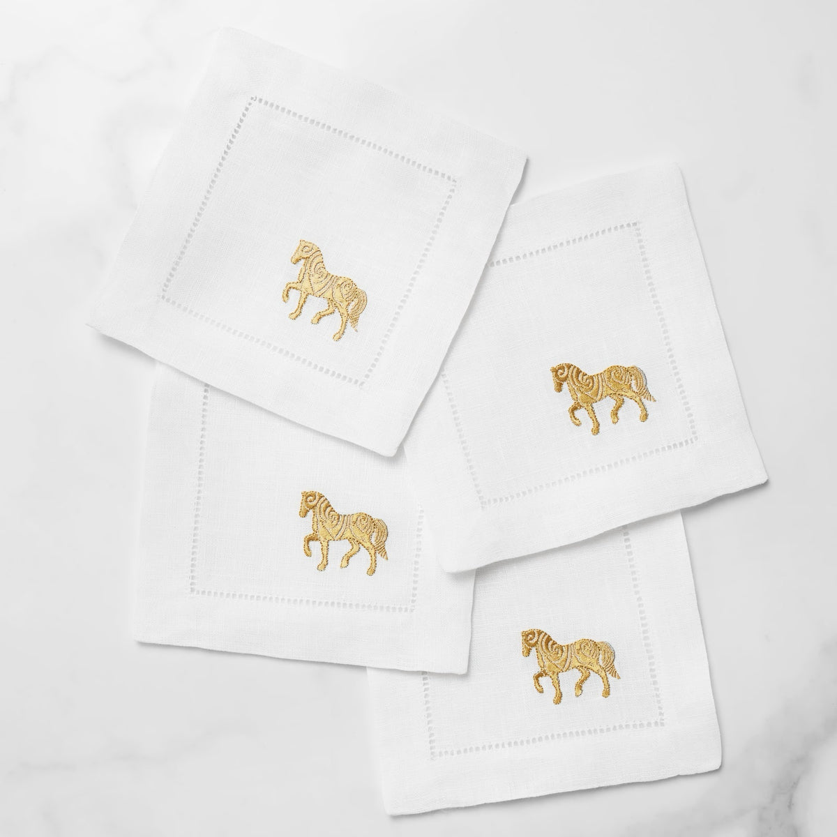 Stack of Sferra Year of the Horse Cocktail Napkins in White and Gold