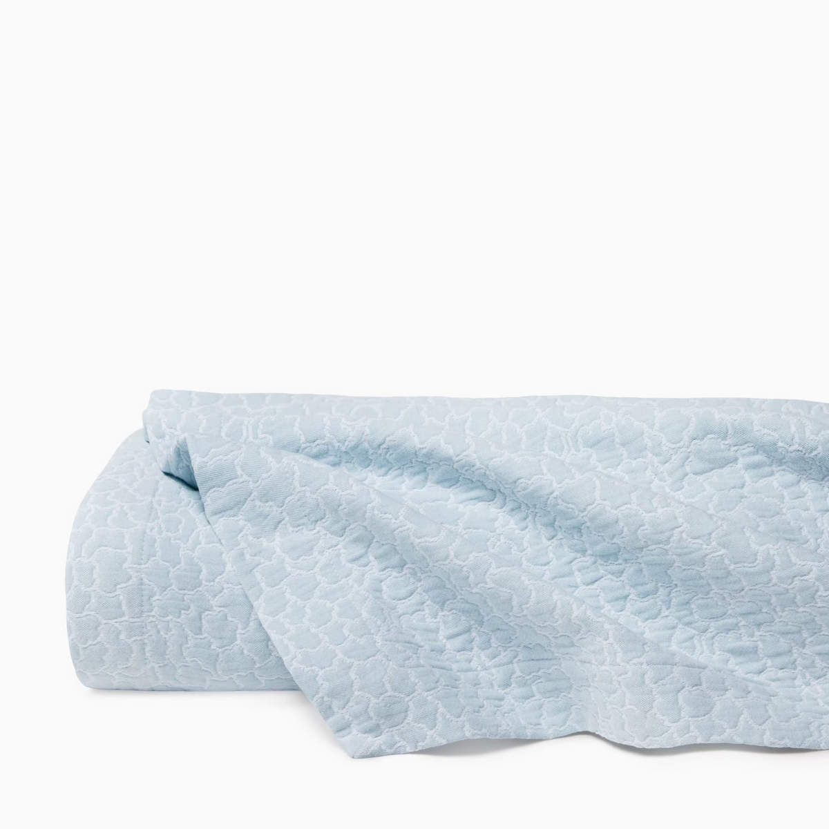 Folded White and Poolside color Sferra x Scalamandre Aurelia Coverlet