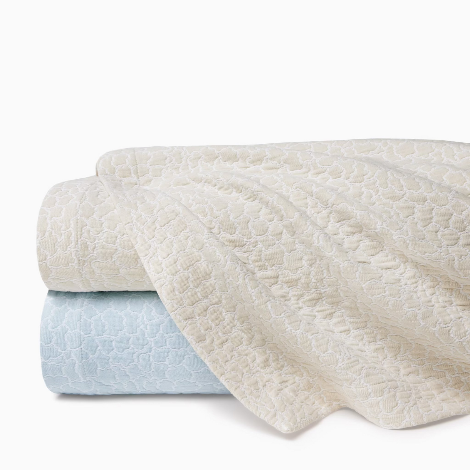 Stack of Sferra x Scalamandre Aurelia Coverlets both colors