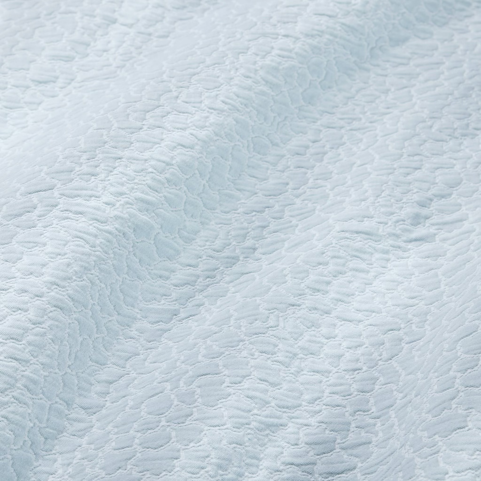 Stack of Sferra x Scalamandre Aurelia Coverlets both colors