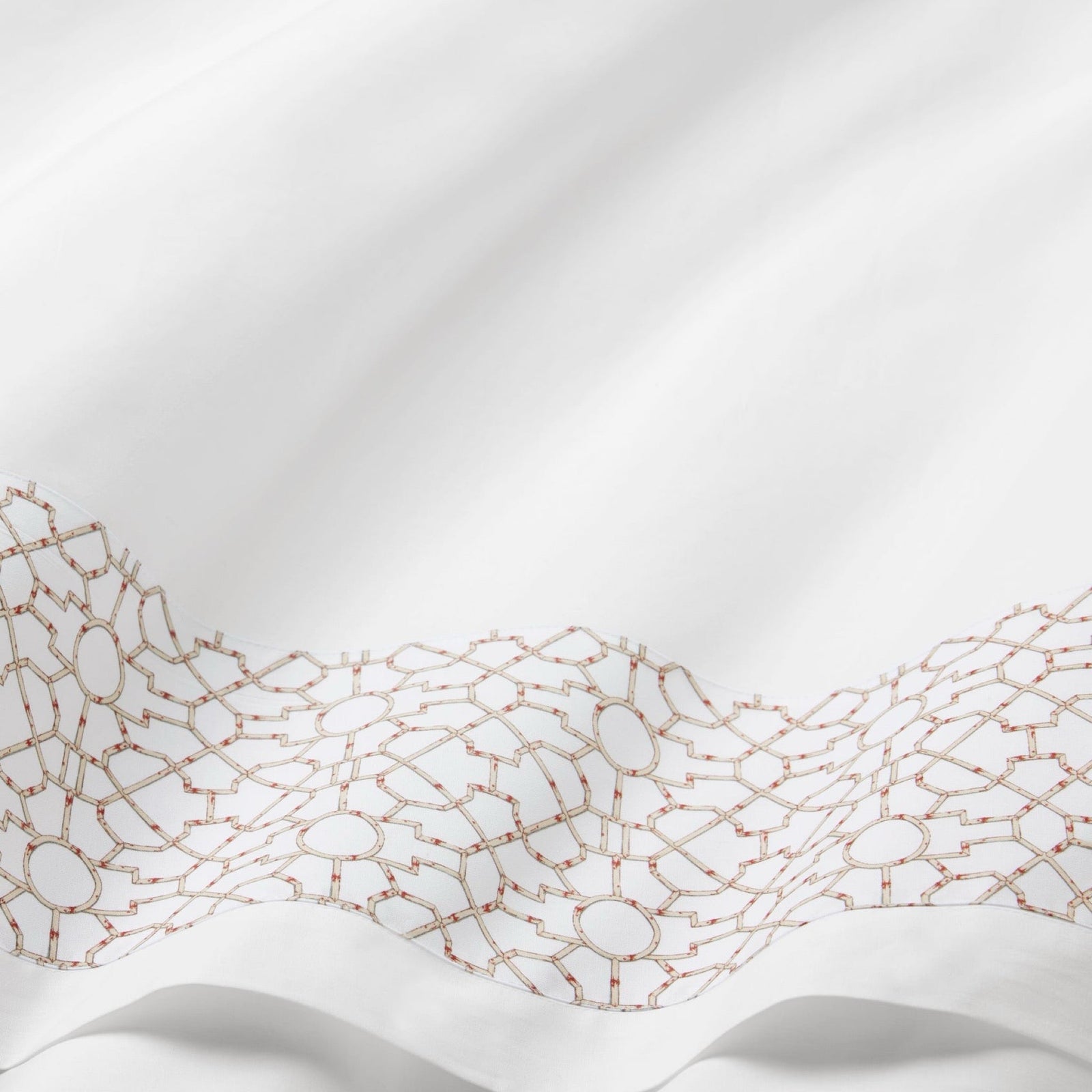 Bedroom with light blue patterned bedding and pillows