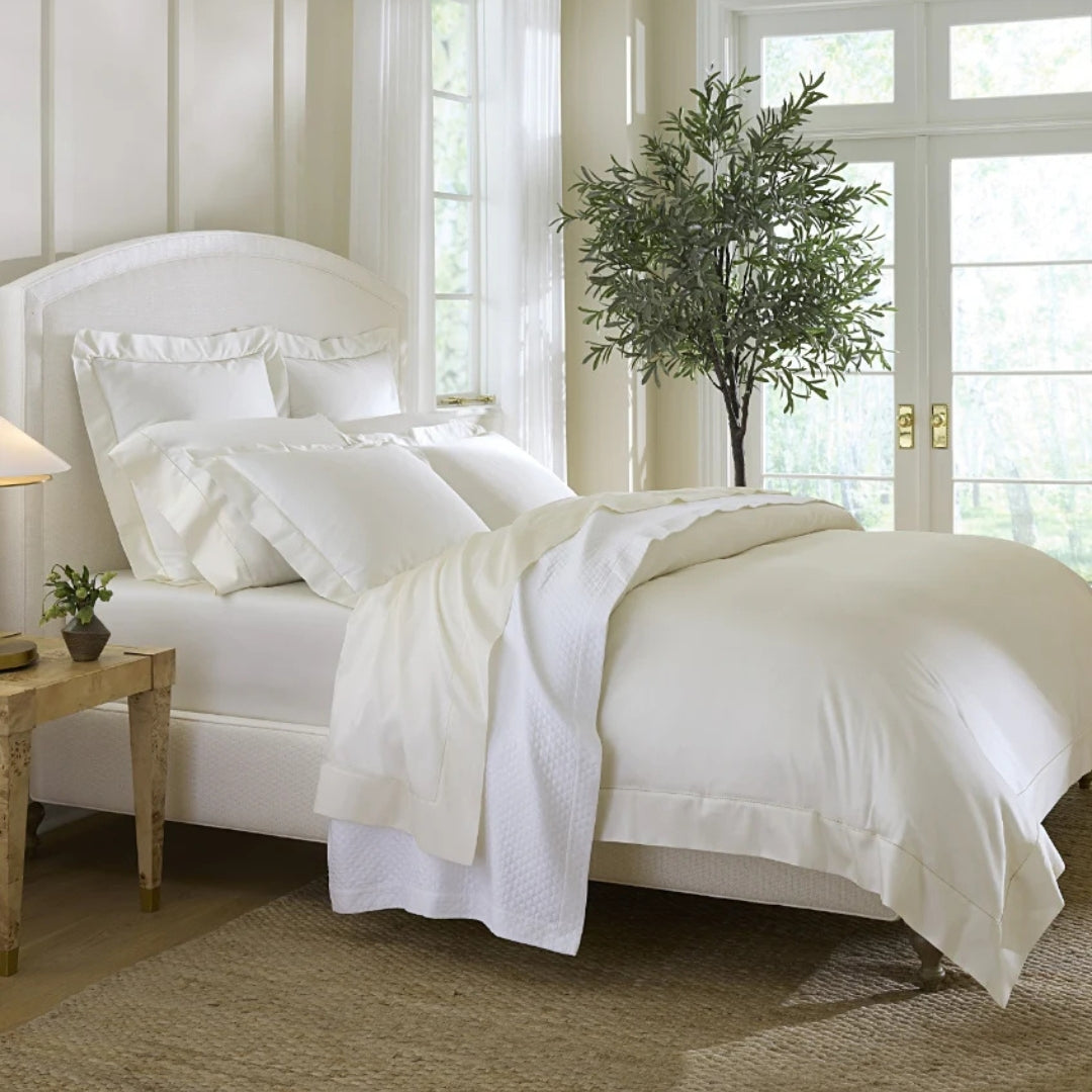 Sferra Giotto bedding lifestyle image with shams and duvet cover side view