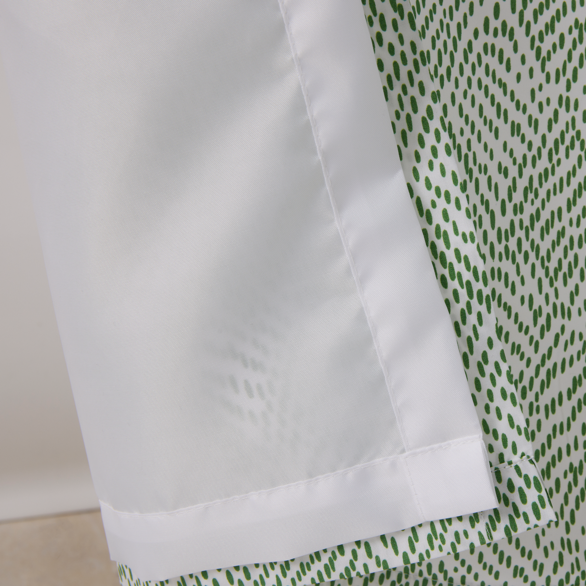 Closeup of White Shower Curtain Liner