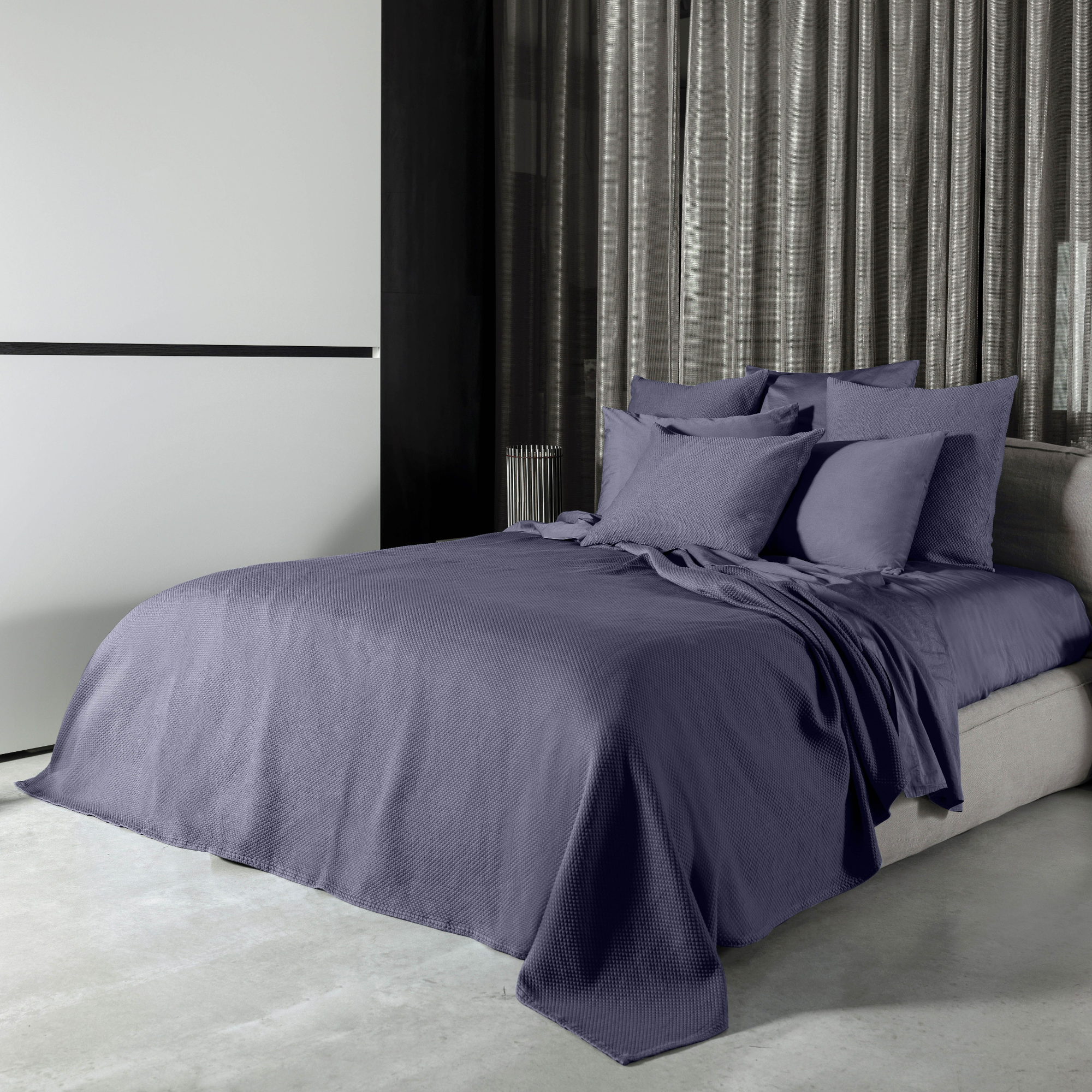 Amethyst Signoria Olivia Coverlet and Shams on a Bed in a Room