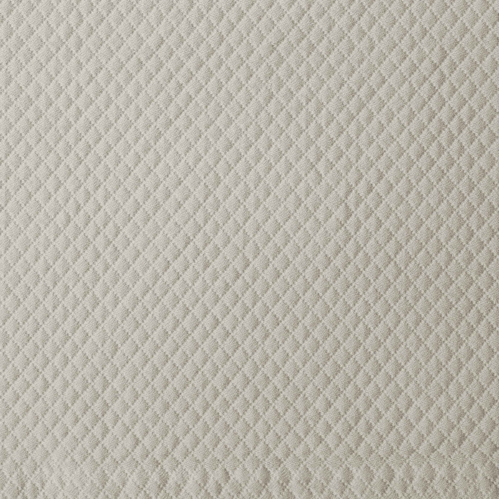 Beige Signoria Olivia Coverlet and Shams on a Bed in a Room