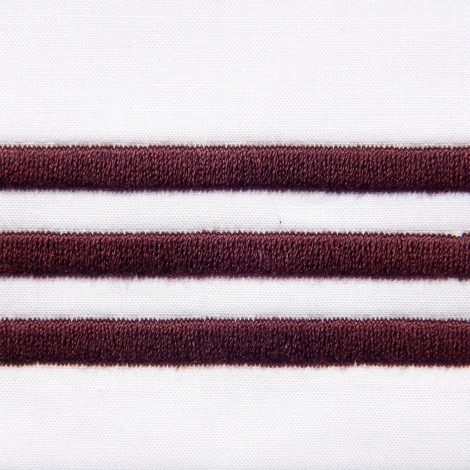 Bed Dressed in Signoria Platinum Percale Bedding in White/Plum Color