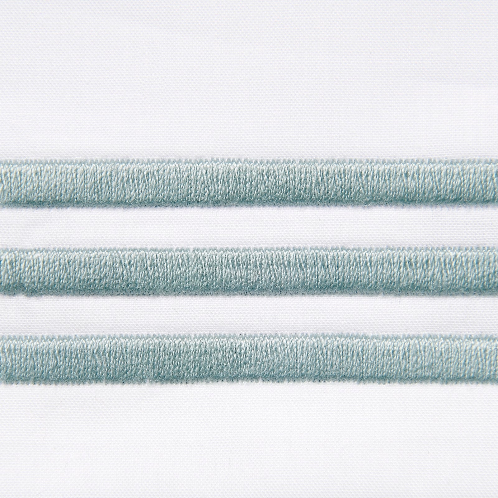 Bed Dressed in Signoria Platinum Percale Bedding in White/Silver Sage Color