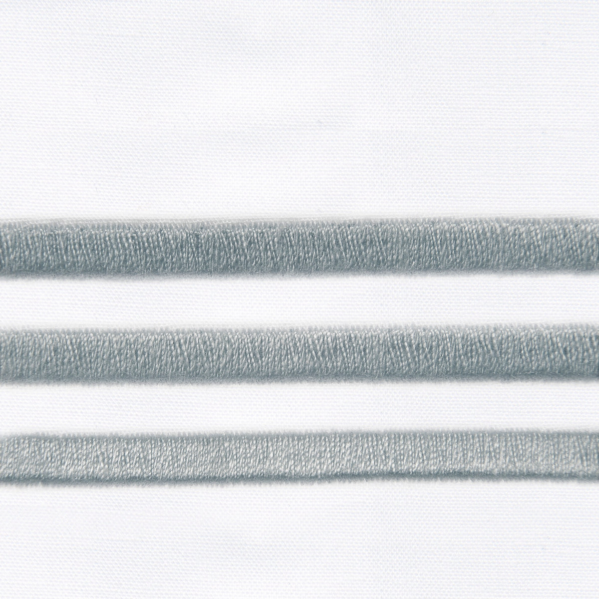 Fabric Closeup of Signoria Platinum Percale Bedding in White/Wilton Blue Color