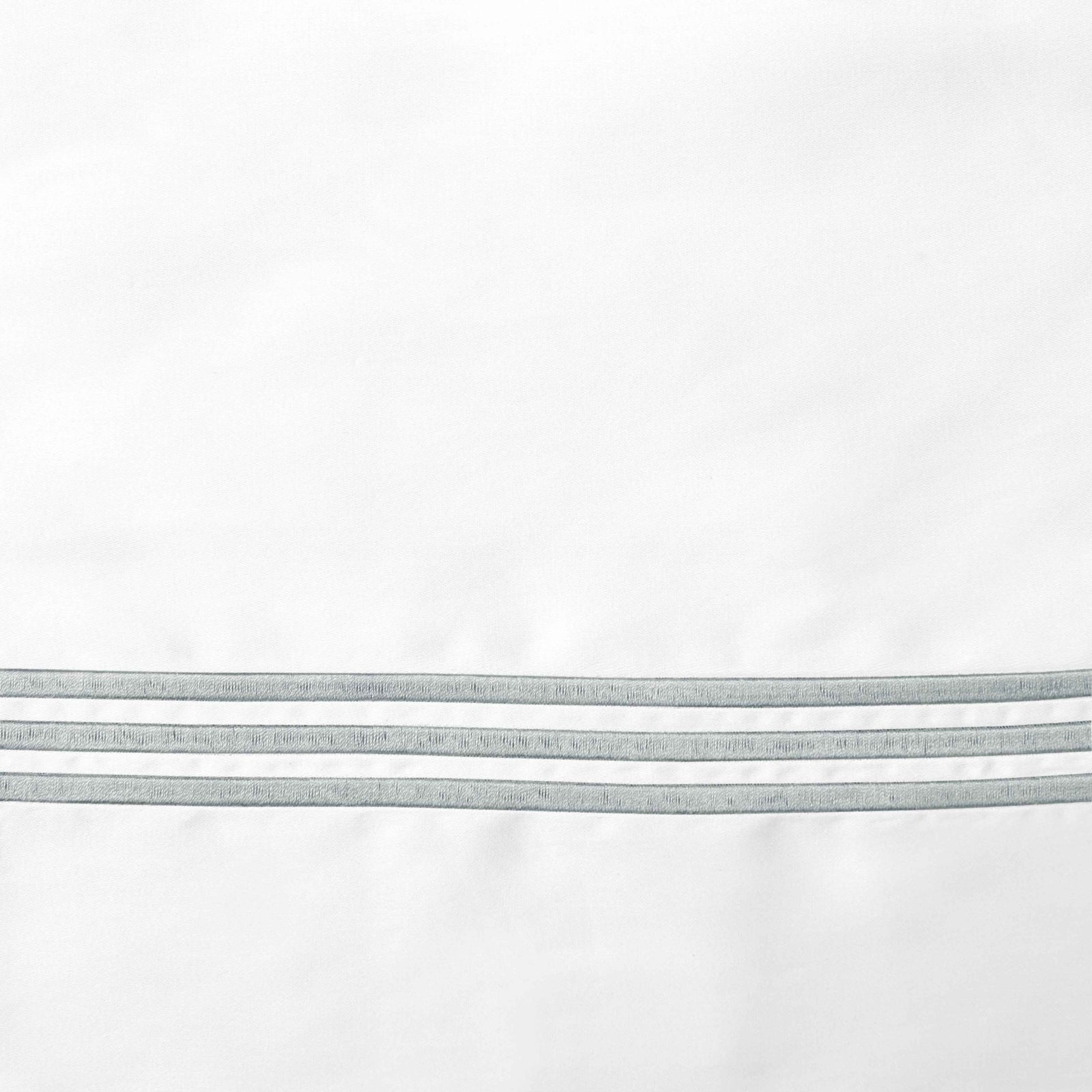 Full Bed Dressed in Signoria Platinum Sateen Bedding with White/Wilton Blue Swatch